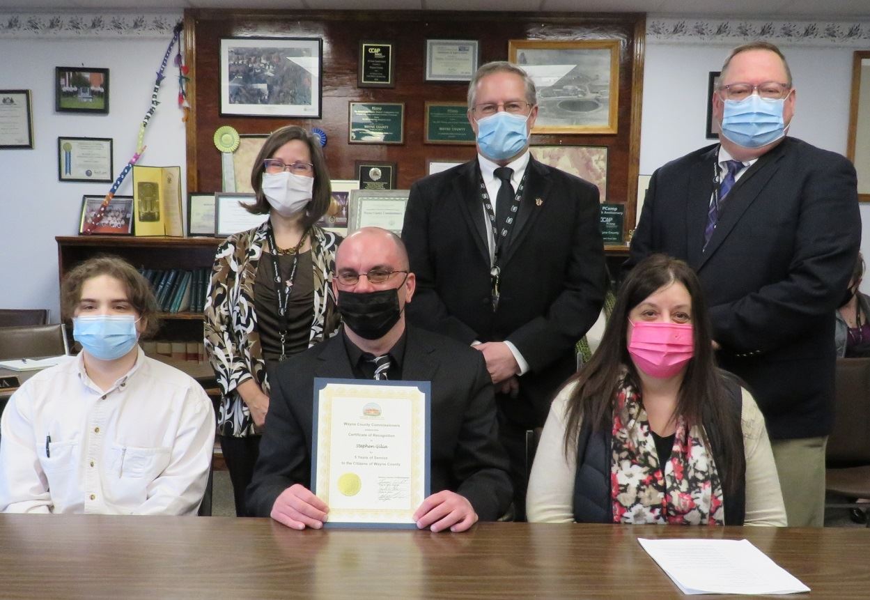 Stephen Gilia  with the Commissioners marking five years of service to the people of Wayne County.